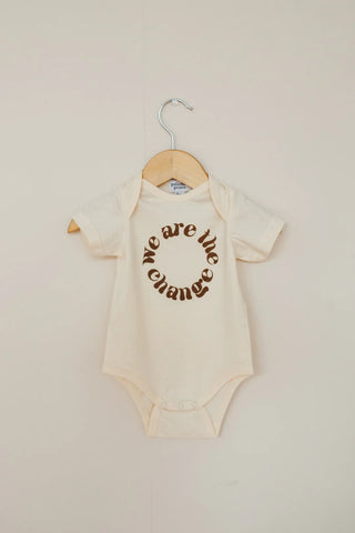 We are the Change Baby Onesie